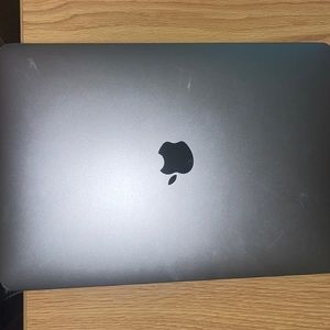 Grey Apple MacBook ! It’s in GREAT condition ,Just don’t use it .